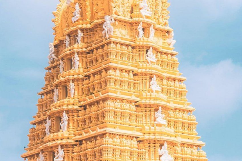 A detailed, multi-tiered temple with intricate carvings and statues. 1