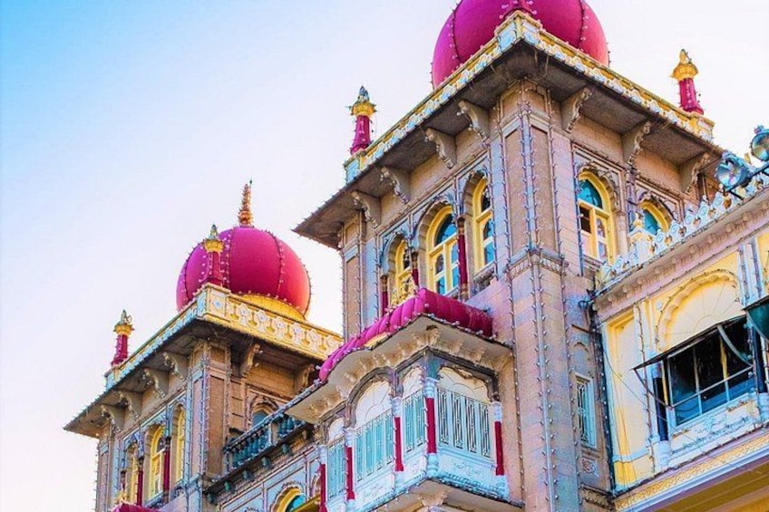 A building with ornate architecture, including domed roofs and detailed carvings. 2