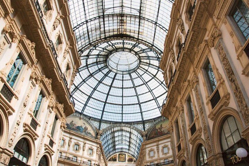 A grand building with a large glass dome and ornate architecture. 3