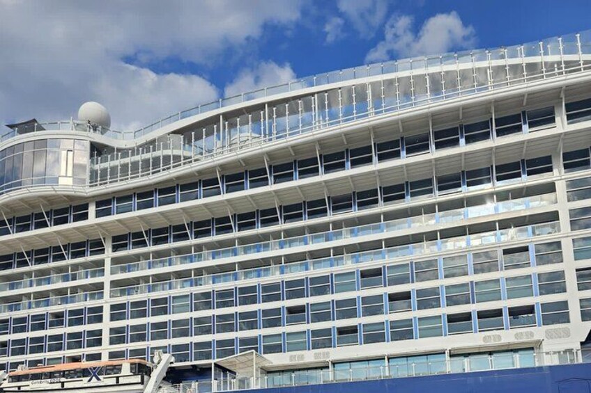 A large cruise ship with multiple decks and a spherical structure on top. 4