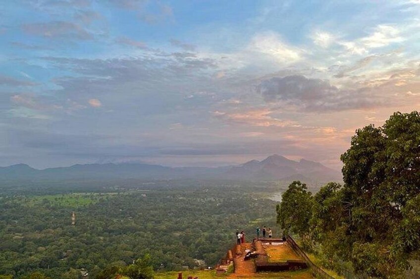 A panoramic view of a mountainous landscape with a clear sky and a distant mountain range. 4
