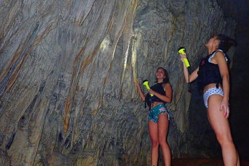 Two people in a cave with rocky walls. 2