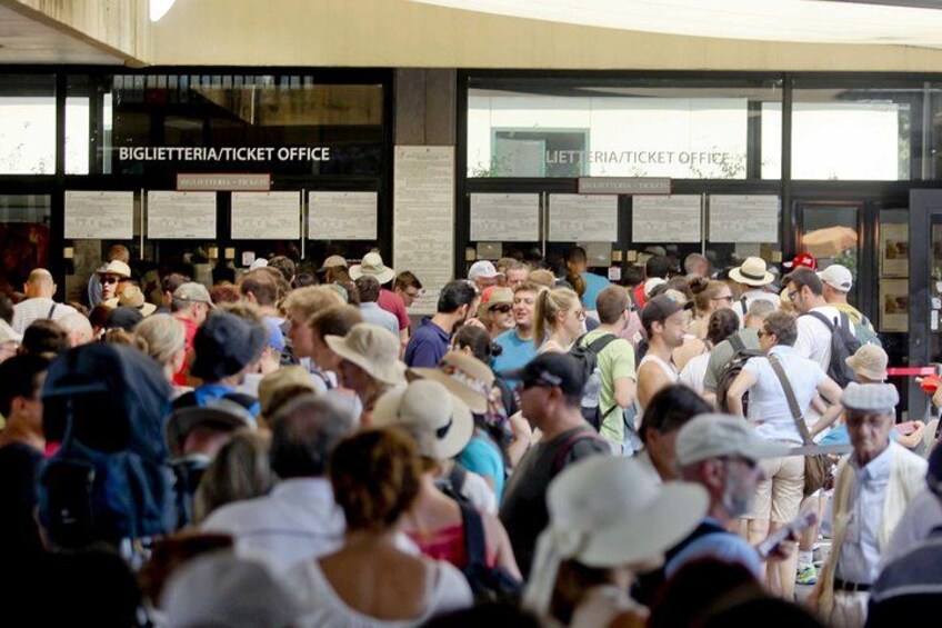 A ticket office with a crowd of people in front. 3