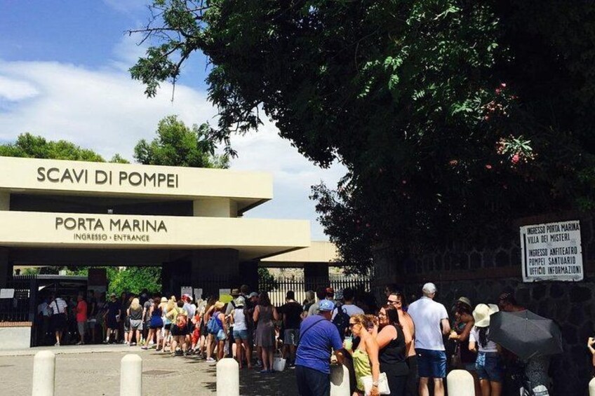 A marina entrance with a crowd of people. 2