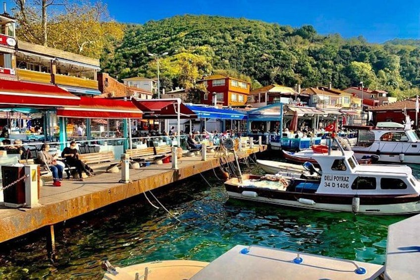 A harbor with boats, a dock, and buildings. 3