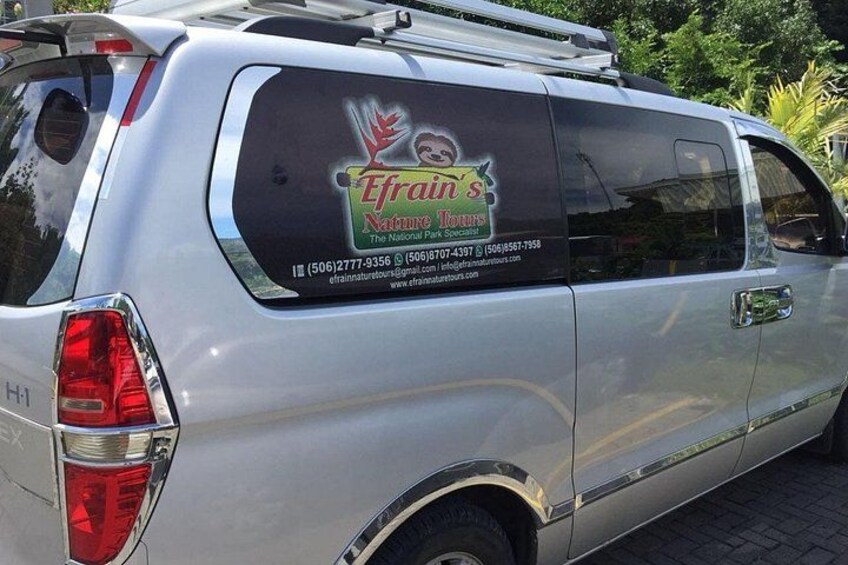 A silver van with a logo and contact information for Efrain's Nature Tours. 3