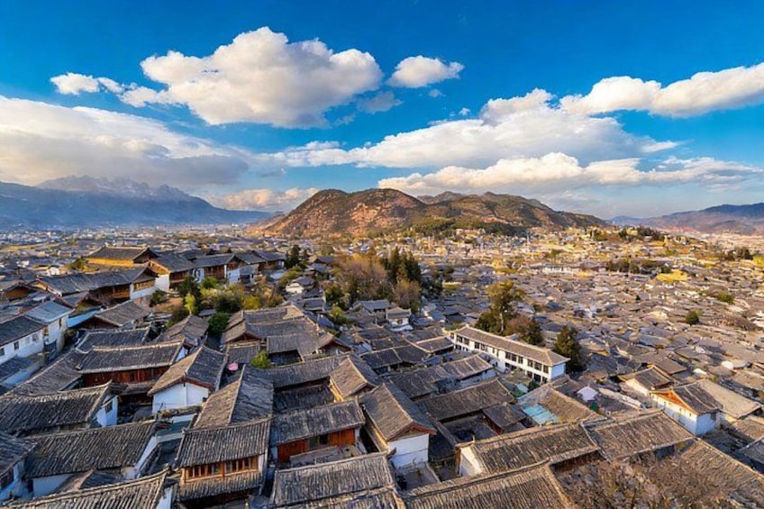 A mountainous landscape with traditional buildings and a clear sky. 5