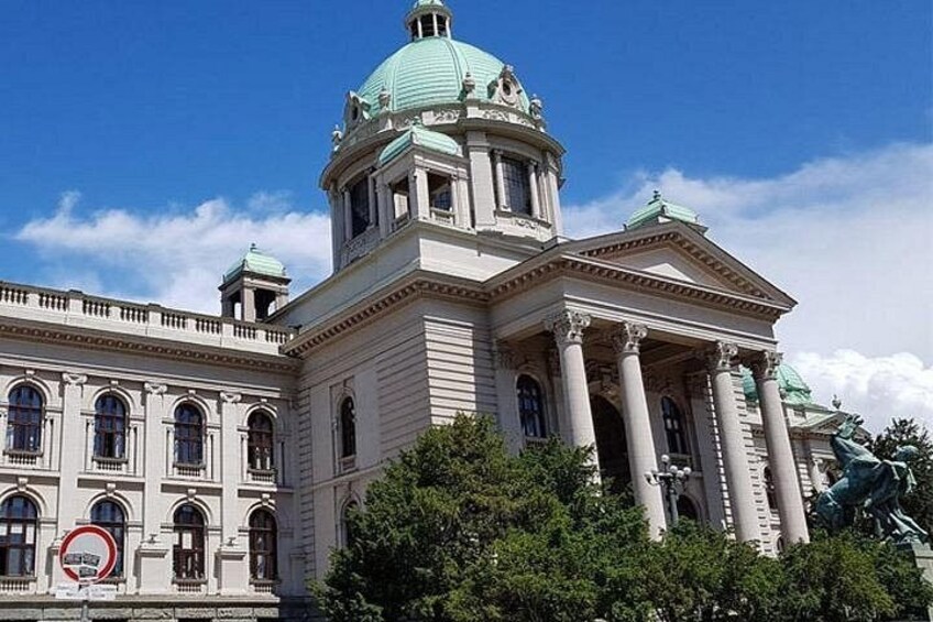 A large, classical building with a prominent dome and columns. 2