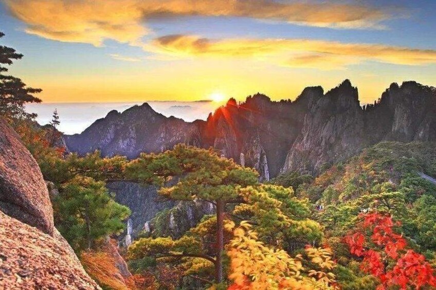A mountainous landscape with autumn foliage, rocky terrain, and a sunset. 5