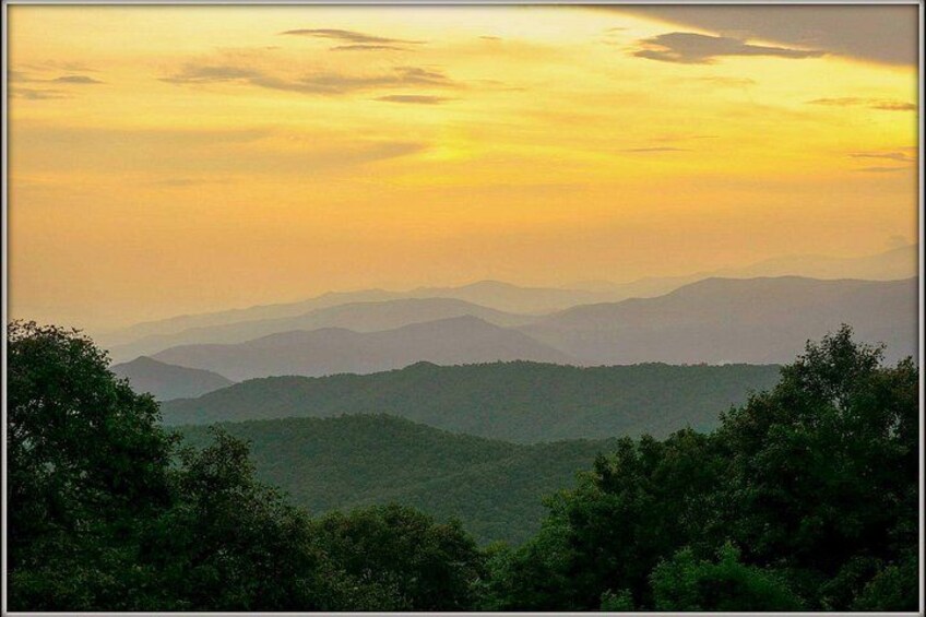 A mountainous landscape with a sunset. 4