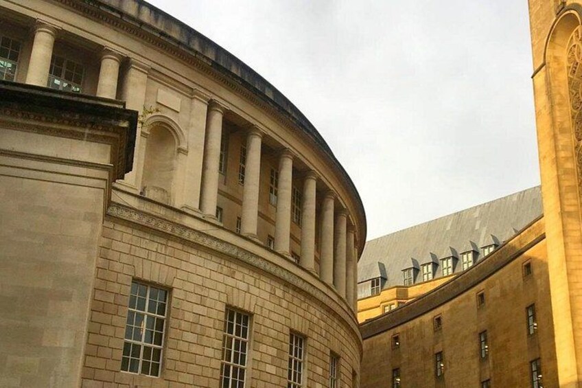 A classical building with columns and a curved facade. 5