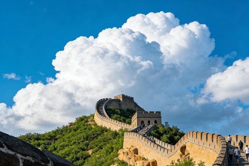 The Great Wall of China winding through a mountainous landscape under a clear sky. 5
