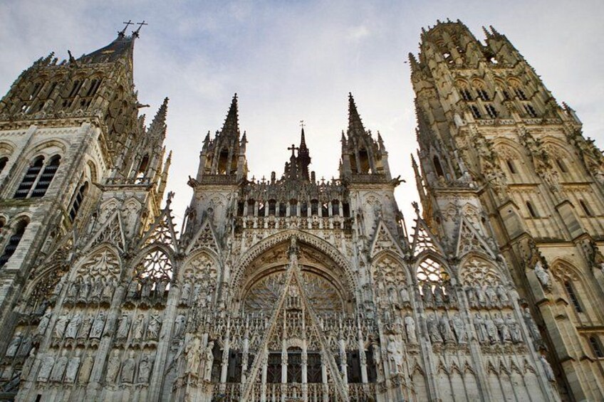A Gothic cathedral with intricate stonework, pointed arches, and flying buttresses. 4