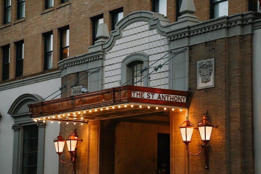 A theater entrance with a marquee reading 'THE ST ANTHONY' and decorative lighting. 3