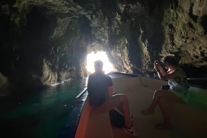 A cave with a boat inside. 2