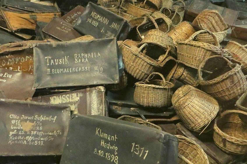 A collection of woven baskets with labels, some with text and numbers. 2