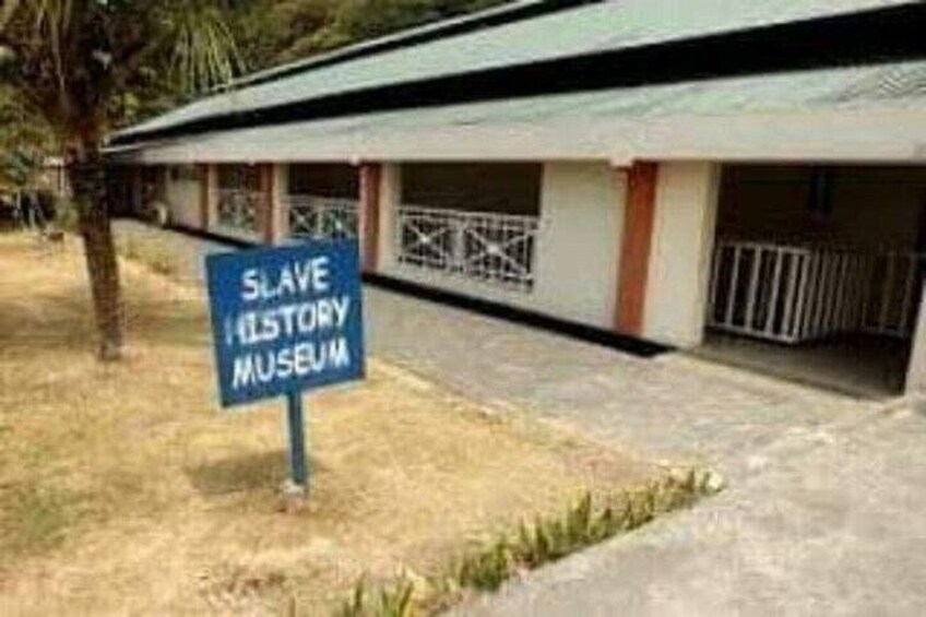 A building with a sign reading 'Slave History Museum.' 1