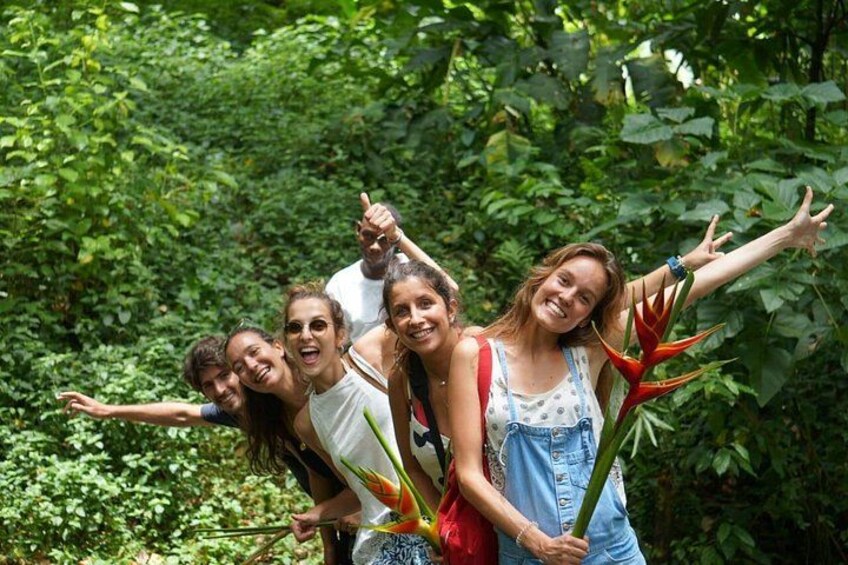 A group of people in a lush green forest. 1