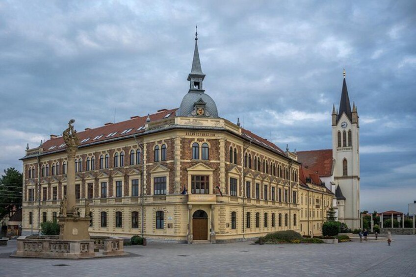 A historic building with a clock tower and a dome. 2