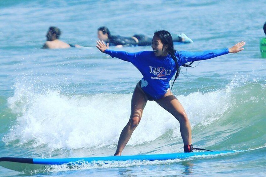 A person surfing on a wave. 1