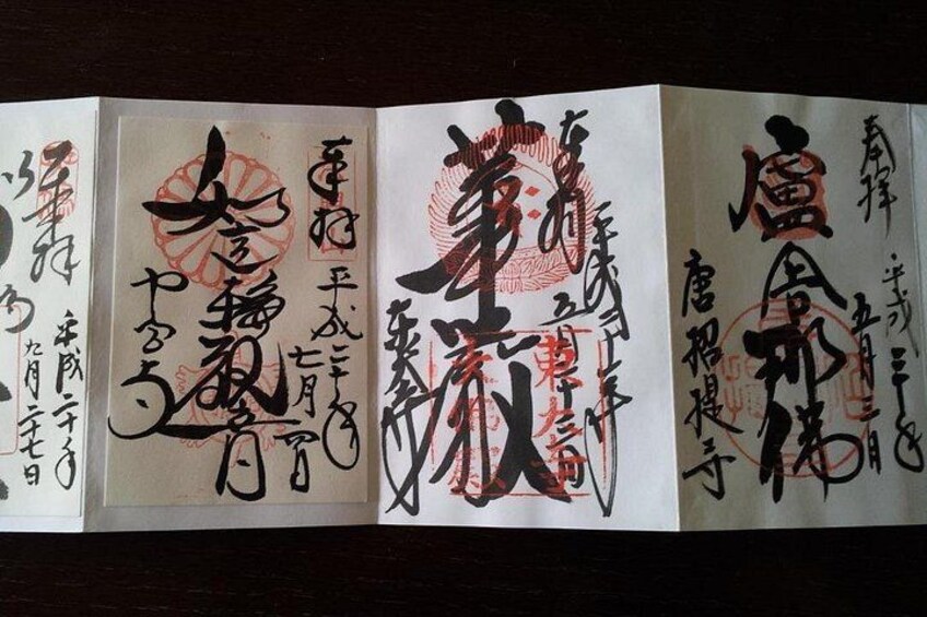 A series of Japanese calligraphy scrolls with red seals. 2