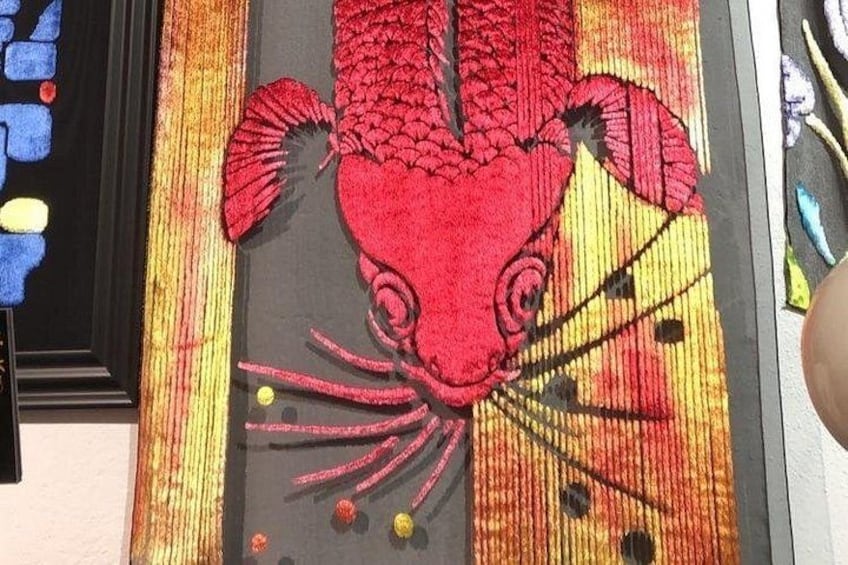 A colorful textile with a red crab pattern. 3