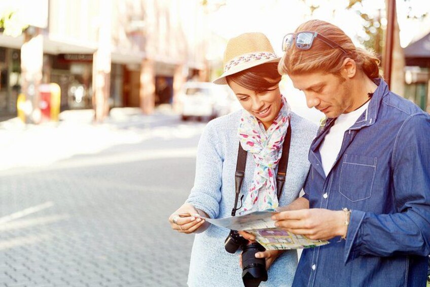 Two people examining a map outdoors. 5