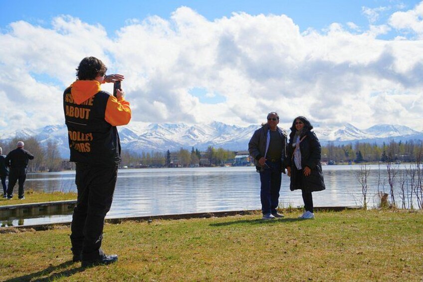 Ambassador Thomas taking a photo of guests in front of lake hood 3
