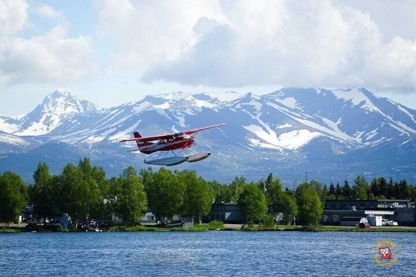 Float plane getting ready to land on water 2