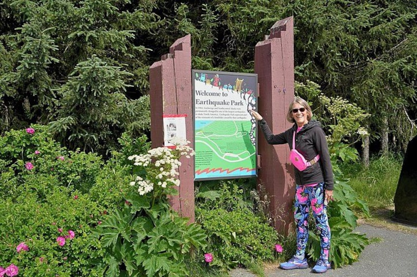 Guest pointing at earthquake Park sign 2