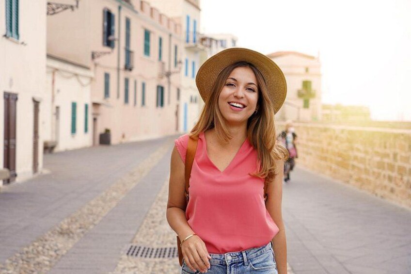 A person standing on a street with buildings in the background. 4