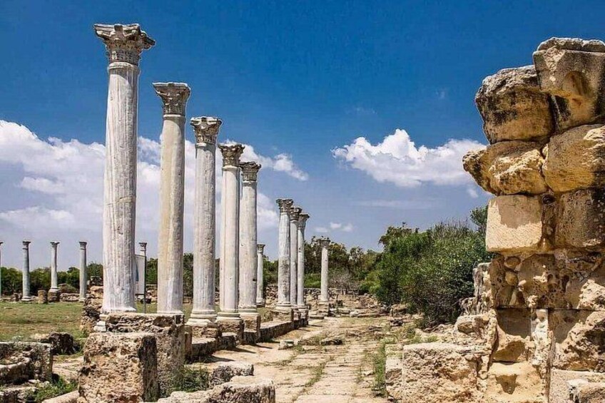 Ancient ruins with columns and stone structures. 2