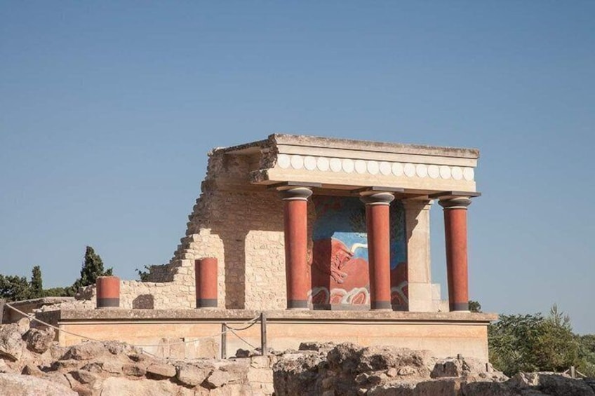 Ancient ruins with columns and a partially intact structure. 2