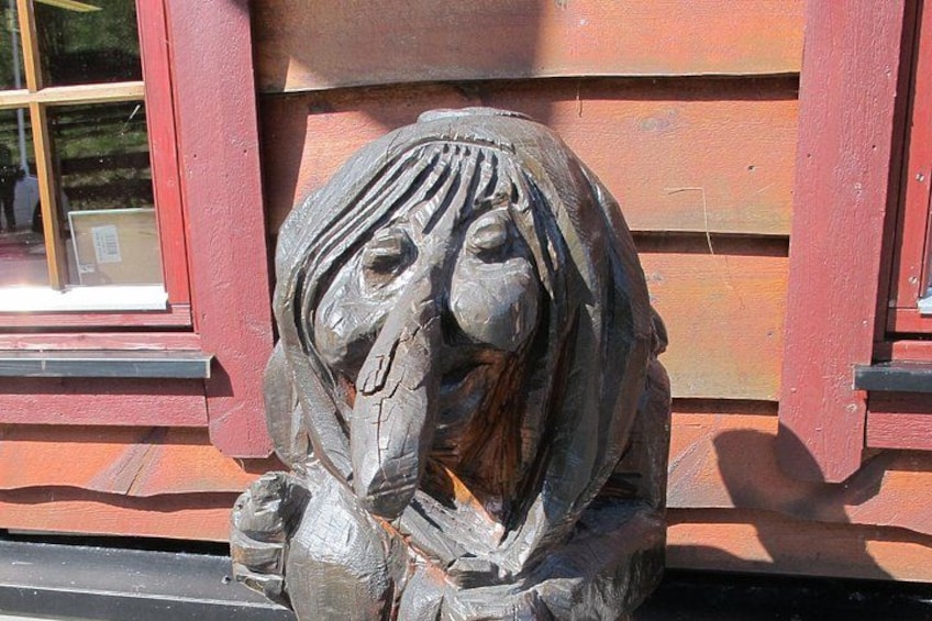 A sculpture of a horse's head mounted on a building. 4
