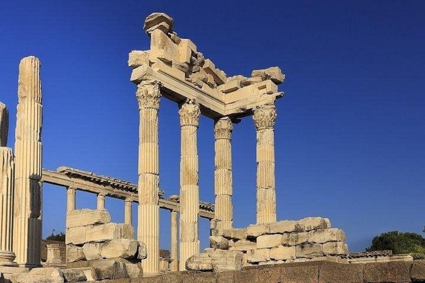 Ancient ruins with columns and stone structures. 3