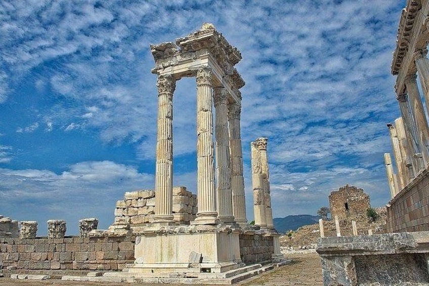 Ancient columns, ruins, and a stone wall. 1