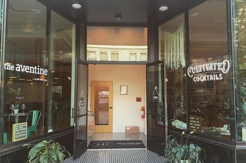 A storefront with signs for 'The Aventine' and 'Cultivated Cocktails'. 2