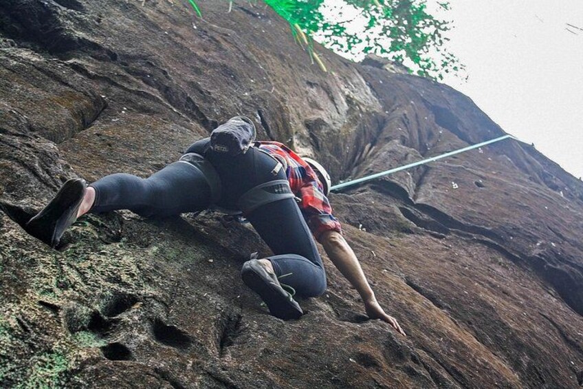 A person climbing a rocky mountain. 4