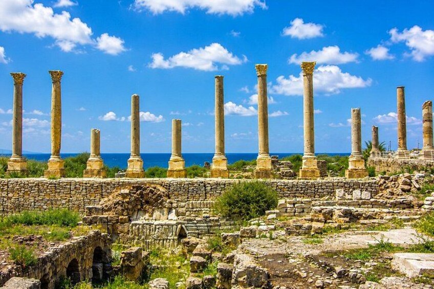 Ancient ruins with columns and stone structures. 2