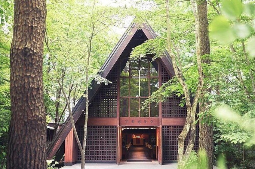 A traditional wooden structure surrounded by trees. 3