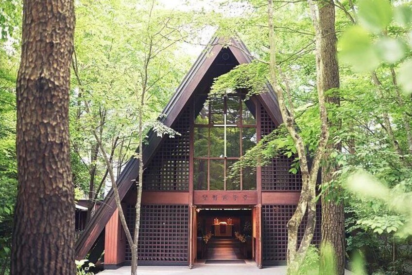 A traditional wooden structure surrounded by trees. 3