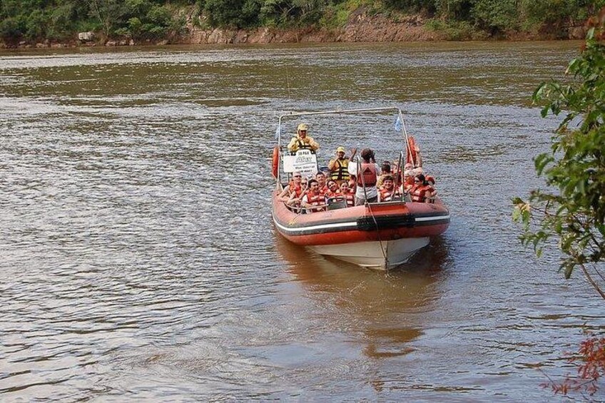 A boat with people on a river. 5