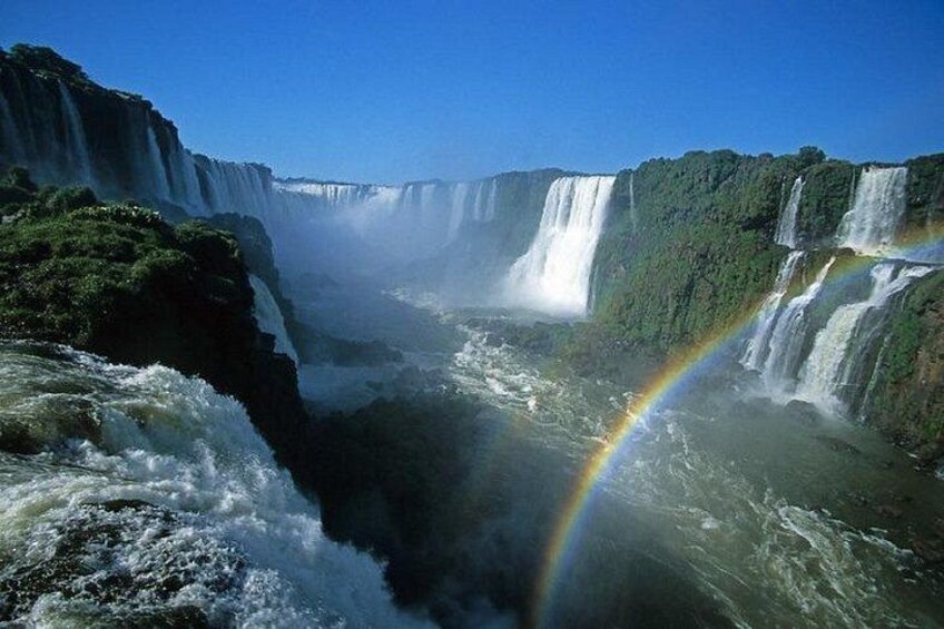 A waterfall with a rainbow. 4