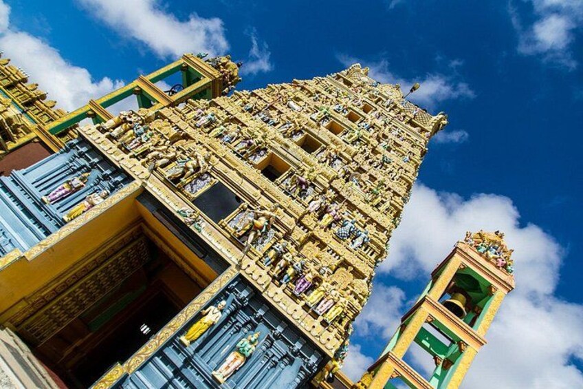 A detailed temple facade with intricate carvings and multiple levels. 4