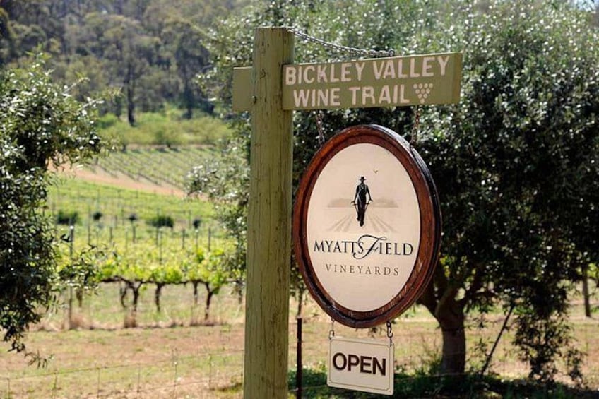 A signpost with 'Bickley Valley Wine Trail' and 'Myatt's Field Vineyards' signs, indicating a wine trail location. 2