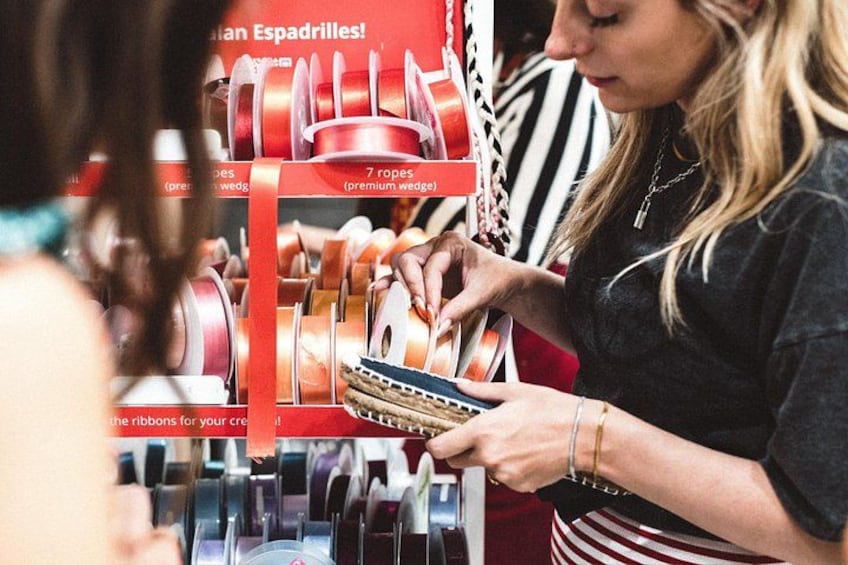 A person selecting ribbons from a display. 4