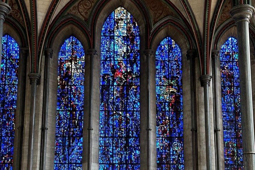 A stained glass window with intricate designs and vibrant colors. 2
