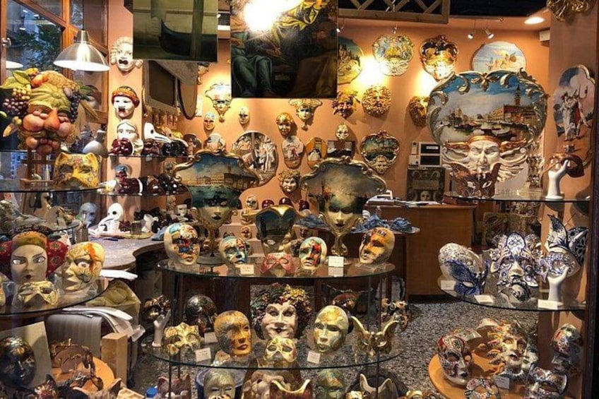 A store with various masks and sculptures. 2