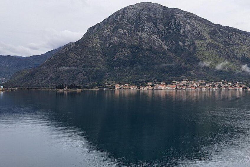 A mountain, a lake, and a town. 5
