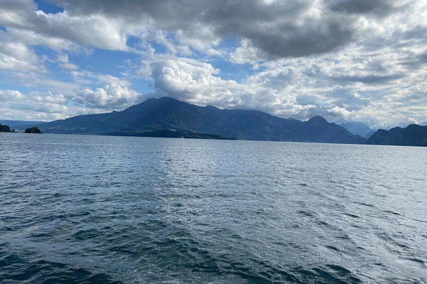 A calm lake with mountains in the background. 4